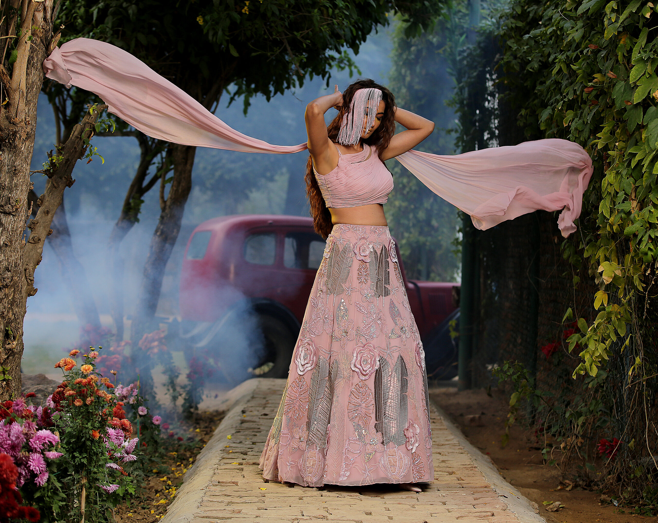 Exquisitely crafted lehenga with fine hues of pink and a touch of silver to bring just the right amount of drama